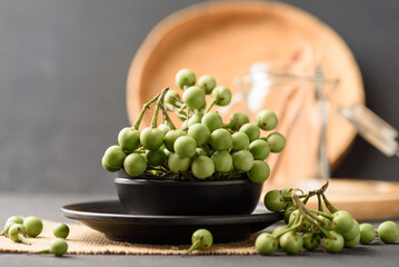 Pea eggplant or turkey berry, Organic local vegetable from northern Thai farmer market on black background