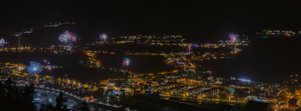 Panoramic view of the fireworks and lights during New Year in Odda City, Norway