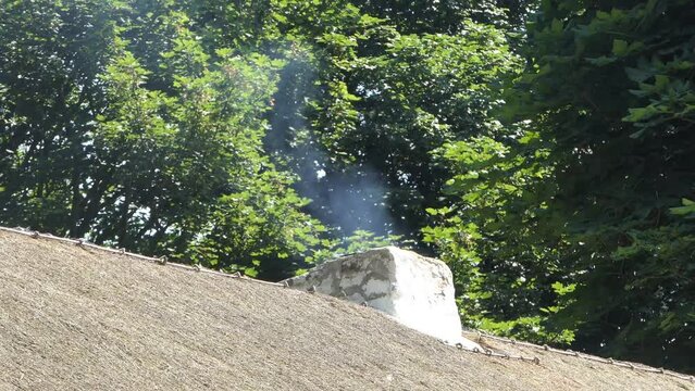 Chimney smoking from an old Irish Cottage