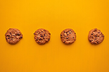 chocolate chip cookies arranged in a straight line 