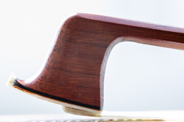 Closeup of a wooden violin bow