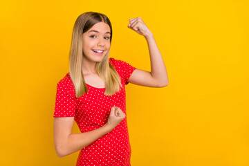Portrait of cheerful overjoyed person raise fists yeah attainment look camera isolated on yellow...
