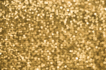 Texture of shiny sparkling lurex fabric golden color.