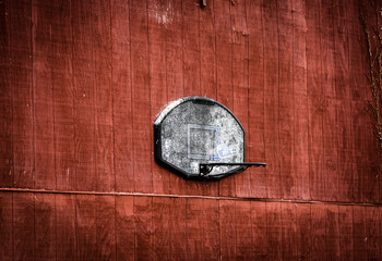 Closeup of a vintage basketball basket hanging on a wooden wall