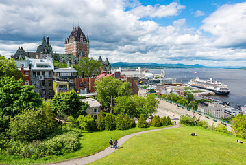 The frontenac castle and the St. Lawrence river with a cruise ship at the harbor in the Quebec city...