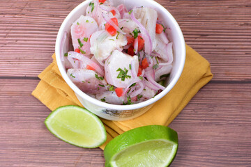 Peruvian ceviche, accompanied by onion, pepper, lemon, salt, coriander