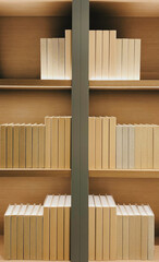 Vertical of a bookshelf full of hardcover books