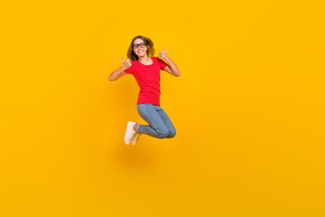 Fototapeta na wymiar Full body profile side photo of youth lady jump show thumbs-up perfect suggest feedback isolated over yellow color background