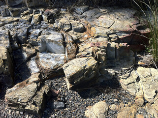 Patterns and textures in rock formations along the riverbanks of the Derwent river Hobart