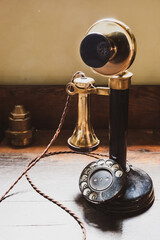 Vertical shot of vintage Victorian 'candlestick' telephone