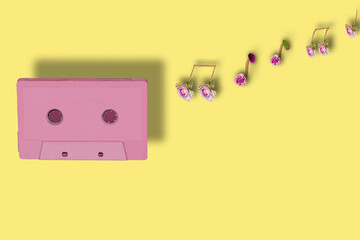 pink cassette with notes creatively connected from parts of a flower, art music design, creative...