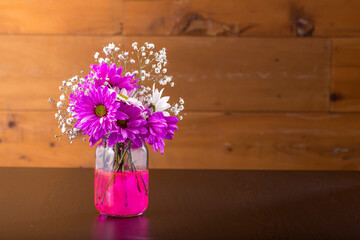 vase with a beautiful bouquet of colorful flowers