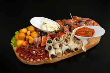 Antipasti served on a wooden board