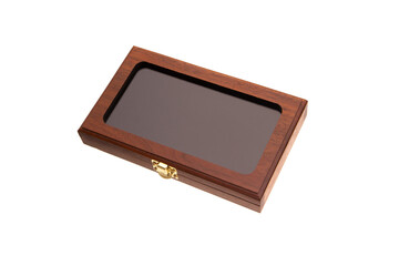 A small wooden box with a transparent glass lid and a metal latch. Luxury packaging for a gift....