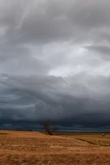 Fotobehang Storm Clouds Over a Rural Farm Field © Steve
