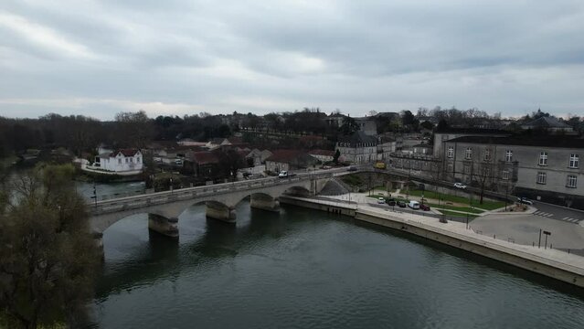 New Bridge or Pont Neuf on the Charente River in Cognac France connecting to the Royal Castle, Aerial pedestal rising shot