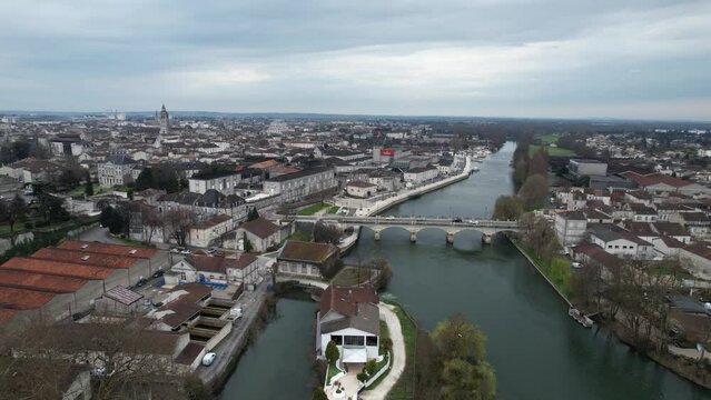 Approaching New Bridge or Pont Neuf over the Charente River in Cognac France, Aerial flyover shot