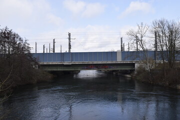 Fototapeta na wymiar Industrial train bridge above the river