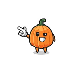 pumpkin mascot pointing top left