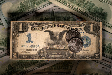 Eagle on half Dollar coins and Silver Certificate Dollar banknote. Historic