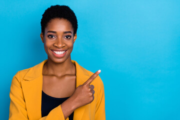 Photo of young cheerful girl guy indicate finger empty space direct select sale isolated over blue...
