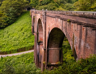 The Menage-bashi Bridge which is a historic 17th-century stone bridge spanning the Nakashima River