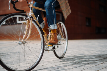 Close up leg shot of man riding bicycle. Eco transport. Modern 