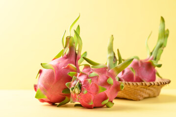 Obraz premium Fresh dragon fruit or pitaya on yellow background, Tropical fruit