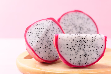 Close up of sliced dragon fruit or pitaya on wooden, Tropical fruit