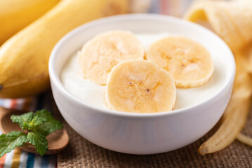 Obraz na płótnie Canvas Yogurt with banana in bowl, Healthy eating