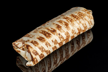 Burritos wraps with beef and vegetables on black background. Beef burrito, mexican food.