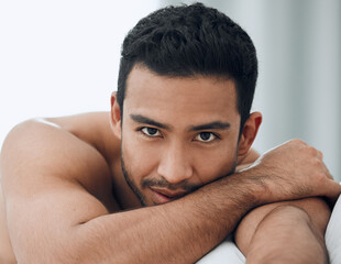 Obraz premium The bedroom is my favourite place for so many reasons. Shot of a handsome young man lying on his bed.