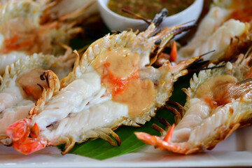 fresh grilled shrimps served on a plate	