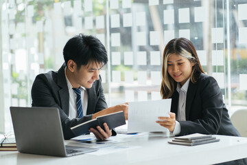 Business people meeting explaining the financial graph data and marketing plan. Group of business people at meeting assessment the state of business investment and marketing.