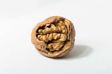 Walnuts are rounded, single-seeded stone fruits of the walnut tree. Cracking a nut.