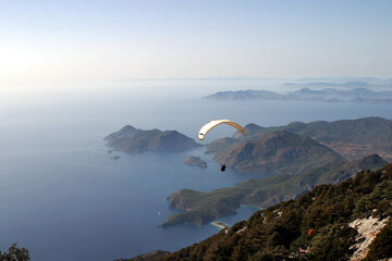 Paraglider fly from Mount Babadag in Fethiye, Turkey. Mount Babadag near Fethiye and a famous paragliding area in Turkey.