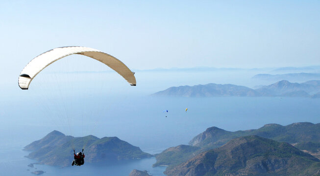 Paraglider fly from Mount Babadag in Fethiye, Turkey. Mount Babadag near Fethiye and a famous paragliding area in Turkey.