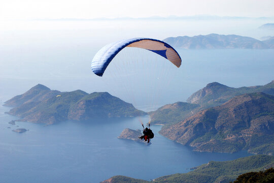 Paraglider fly from Mount Babadag in Fethiye, Turkey. Mount Babadag near Fethiye and a famous paragliding area in Turkey.