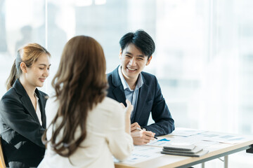 Fototapeta premium Young People Working Planning Start Up.Group Young Man and Women Looking Report Office,Business Team Coworker Global Sharing Economy.