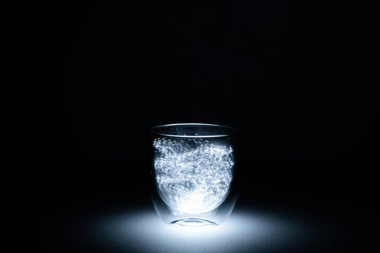In the image can see a lantern light inside of a glass. This looks like an aura.