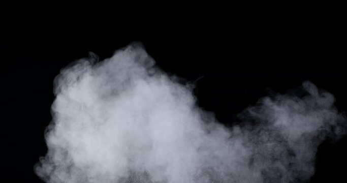 An explosion of dust from the ashes on a black background.