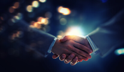 Partnership concept. Image of handshake . Mixed media