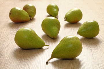 Ripe pears on wooden plank     