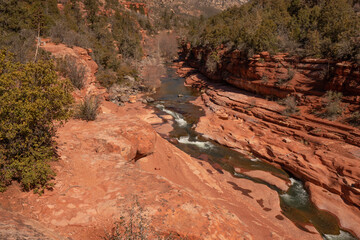 red rock canyon with river at bottom 