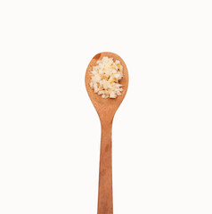On top Ginger cut into small dice in wooden spoon isolated on white background. Clipping path.