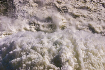 Fototapeta na wymiar Close up of roaring water gushing from pressure outlet at Lake Hume dam