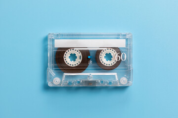Vintage audio cassette on blue background
