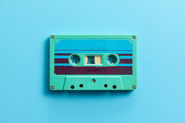 Vintage audio cassette on blue background