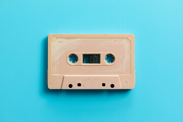 Vintage audio cassette on blue background