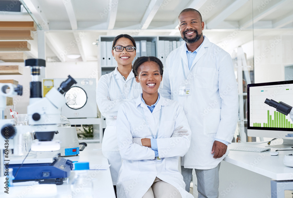 Poster Curiosity is one of the greatest strengths we possess. Portrait of a group of scientists working in a lab.